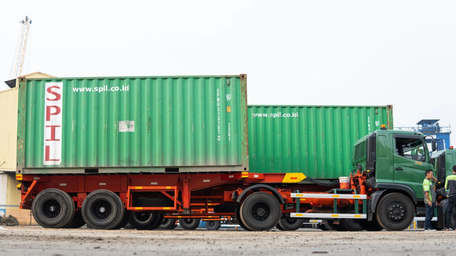 Truck loaded with 20-foot containers at the terminal