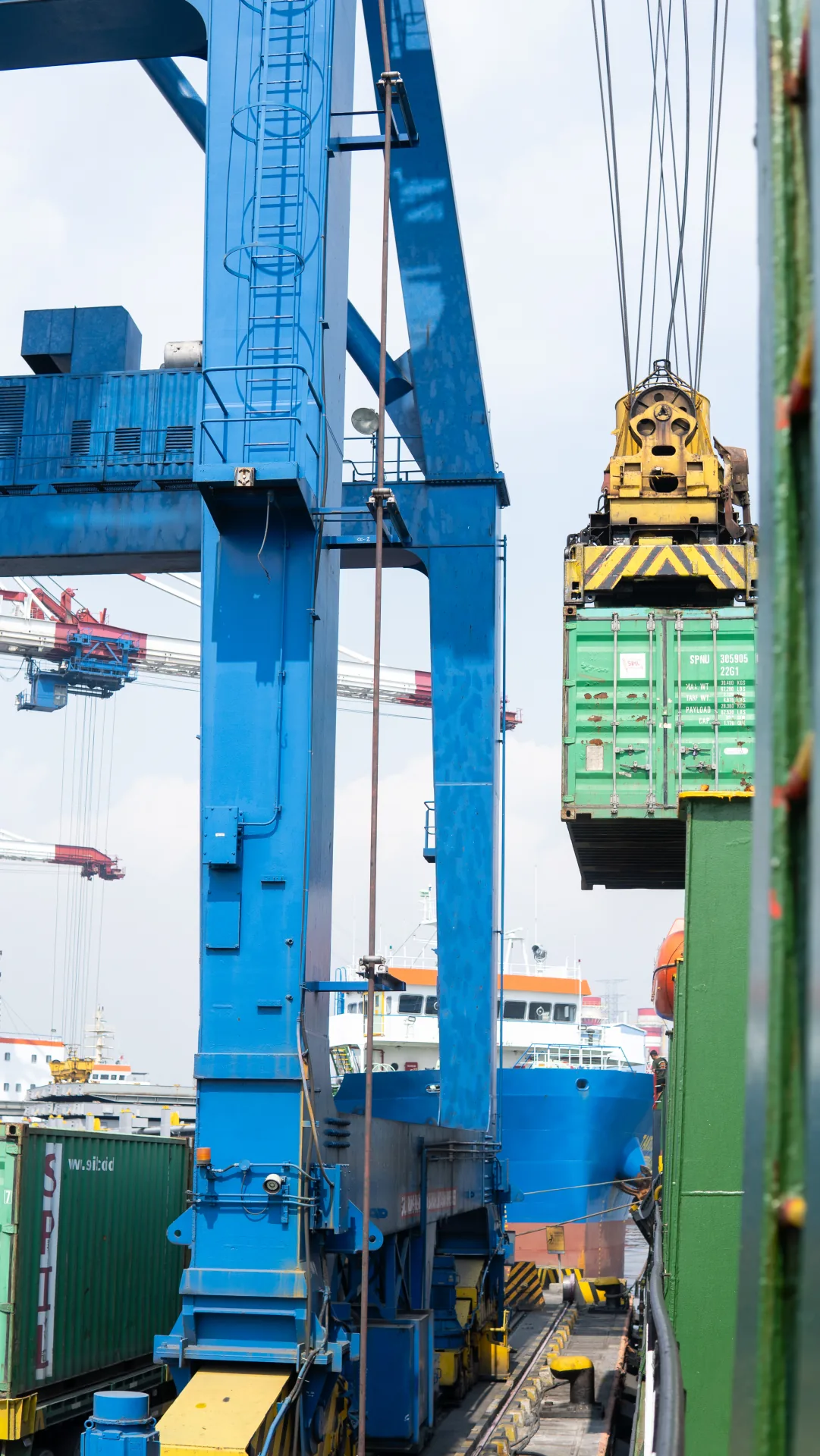Ship-to-shore crane loading a container onto a vessel