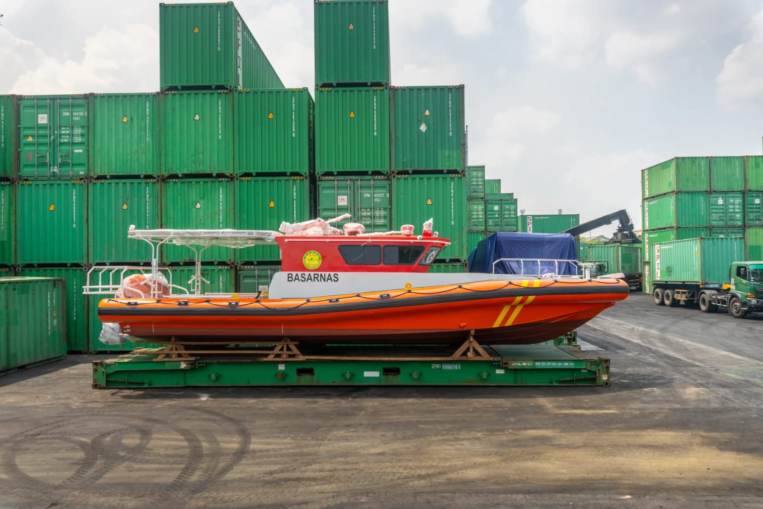 BASARNAS rescue boat secured on a flat rack container