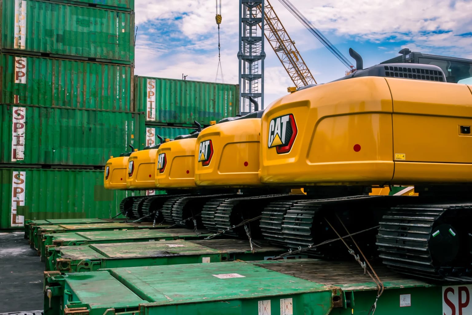 Caterpillar excavators loaded on flat racks for shipment