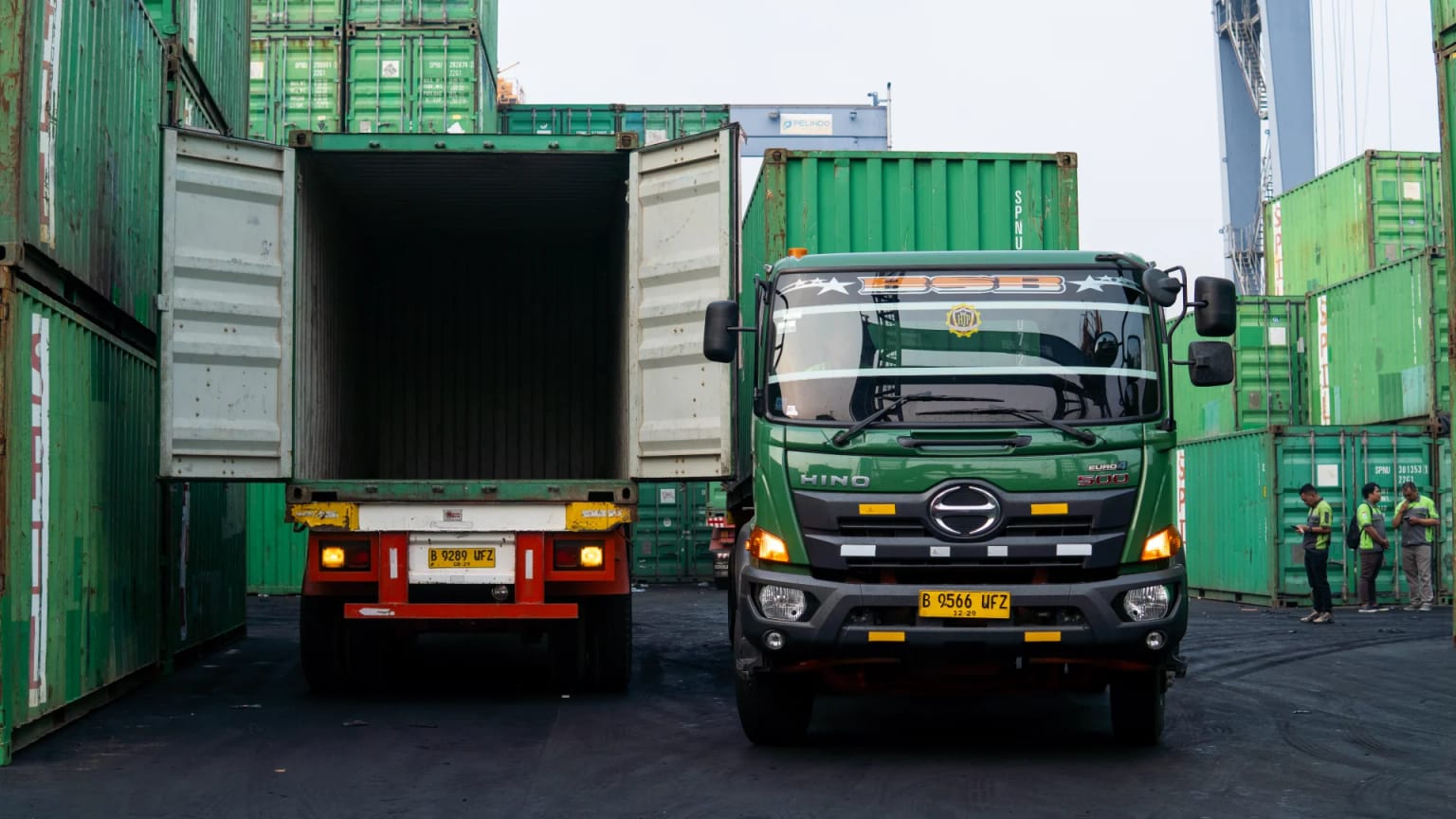 BSB truck beside an open container at the container yard