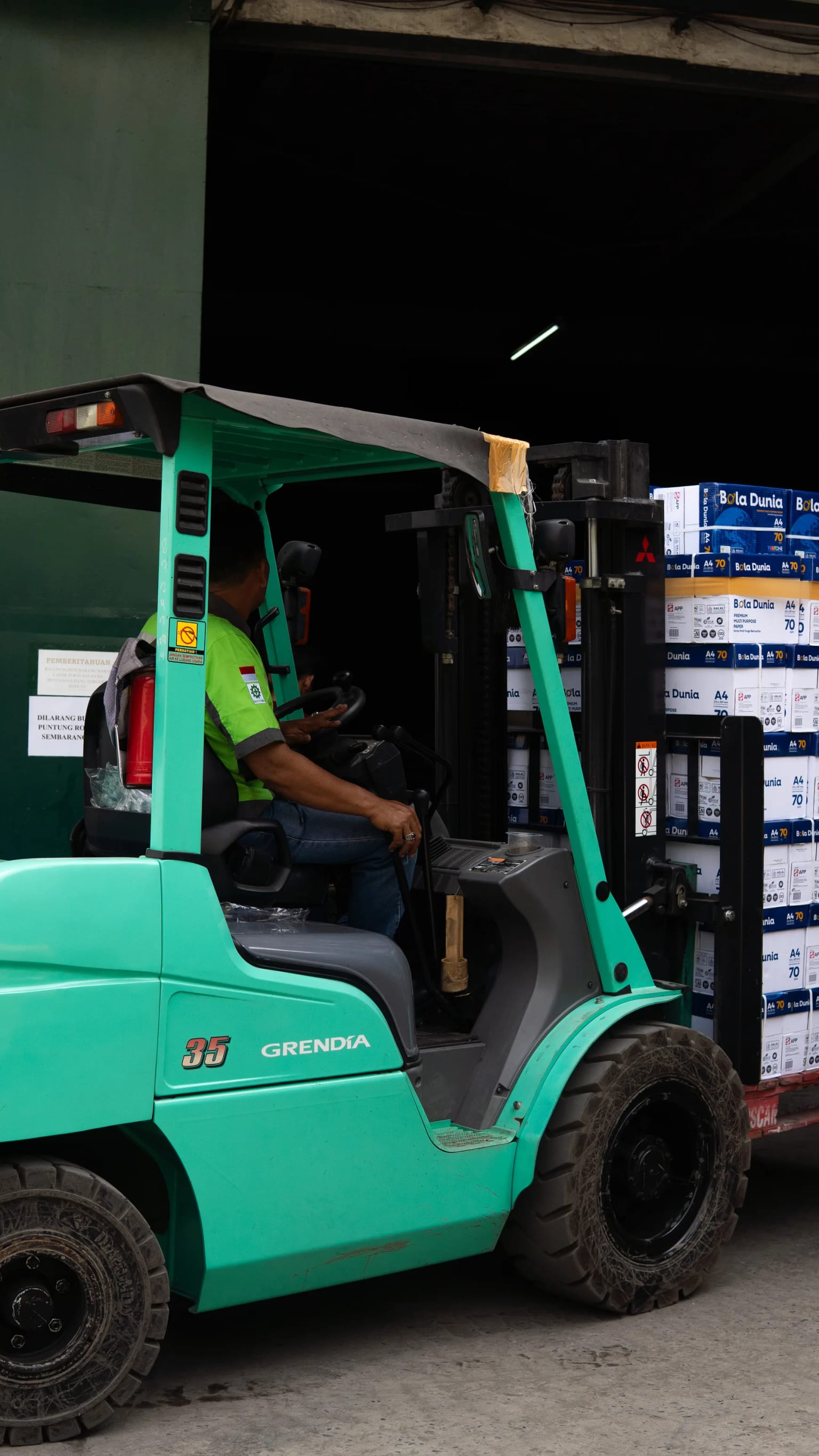 Forklift operator handling cargo